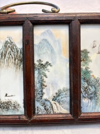A set of four Chinese famille rose 'Landscape' plaques mounted in a wooden frame, signed Wang Yunquan 王雲泉, together with four plaques, 20th C.