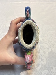 A Chinese famille rose ewer in the form of a dragon and two carps with wooden cover and stand, 19th C.