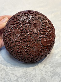 Two Chinese cinnabar lacquer covered boxes and a bottle vase, 19th C.