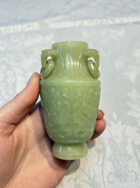 A Chinese celadon jade covered vase, with wooden stand, and a bowl with wooden cover and stand, 19/20th C.