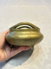 Two Chinese bronze tripod censers, Xuande and double-vajra mark, 19th C.