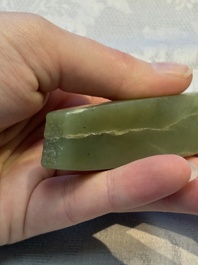A Chinese celadon jade snuff bottle, a plaque and a ritual stick, Han and later