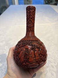 Two Chinese cinnabar lacquer covered boxes and a bottle vase, 19th C.