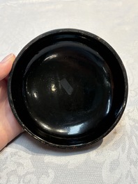 Two Chinese cinnabar lacquer covered boxes and a bottle vase, 19th C.