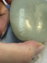 A Chinese celadon jade snuff bottle, a plaque and a ritual stick, Han and later