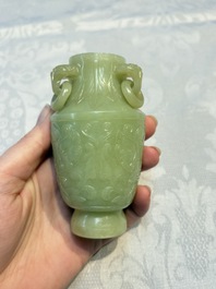 A Chinese celadon jade covered vase, with wooden stand, and a bowl with wooden cover and stand, 19/20th C.