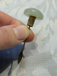 A Chinese celadon jade snuff bottle, a plaque and a ritual stick, Han and later