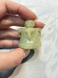 A Chinese celadon jade covered vase, with wooden stand, and a bowl with wooden cover and stand, 19/20th C.