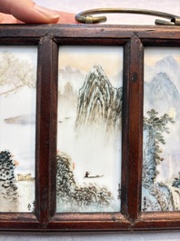 A set of four Chinese famille rose 'Landscape' plaques mounted in a wooden frame, signed Wang Yunquan 王雲泉, together with four plaques, 20th C.