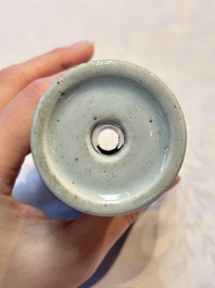 A pair of Chinese blue and white 'Dragons Chasing the Flaming Pearl&rsquo; candlesticks, 19th C.