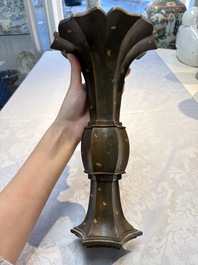 A Chinese gold-splashed bronze 'Gu' vase, Xuande mark, 17/18th C.