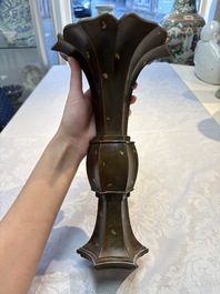 A Chinese gold-splashed bronze 'Gu' vase, Xuande mark, 17/18th C.