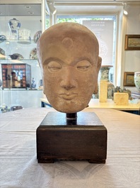 A Chinese sandstone head of a Luohan, early Qing