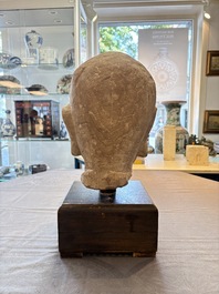 A Chinese sandstone head of a Luohan, early Qing