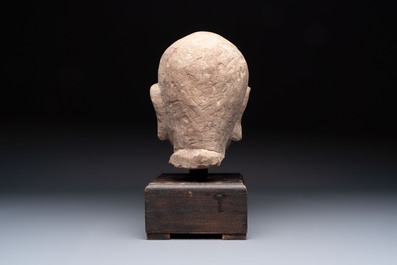 A Chinese sandstone head of a Luohan, early Qing
