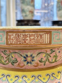 An impressive Chinese famille rose 'Bajixiang and Lotus Scroll' tripod censer with a wooden cover, Jiaqing mark and of the period
