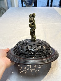 An impressive Chinese famille rose 'Bajixiang and Lotus Scroll' tripod censer with a wooden cover, Jiaqing mark and of the period