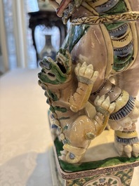 A pair of Chinese verte biscuit models of Buddhist lions, 18th C.