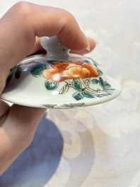 A pair of Chinese famille verte covered jars, a Tieguai Li figure, a blue and white teapot and a biscuit saucer, Kangxi and Qing Yu Tang mark, 19th C.