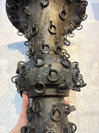 A Chinese archaistic bronze 'Zun' vase with 99 rings, 18/19th C.