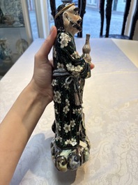 A pair of Chinese famille verte covered jars, a Tieguai Li figure, a blue and white teapot and a biscuit saucer, Kangxi and Qing Yu Tang mark, 19th C.