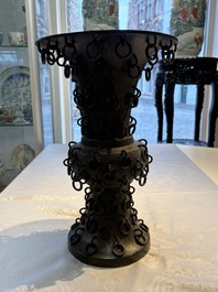 A Chinese archaistic bronze 'Zun' vase with 99 rings, 18/19th C.