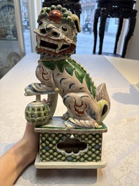 A pair of Chinese verte biscuit models of Buddhist lions, 18th C.