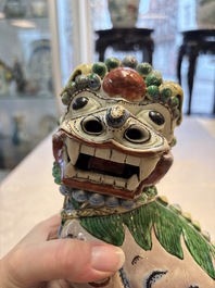 A pair of Chinese verte biscuit models of Buddhist lions, 18th C.