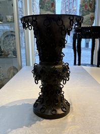 A Chinese archaistic bronze 'Zun' vase with 99 rings, 18/19th C.