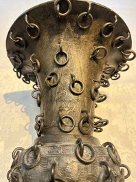 A Chinese archaistic bronze 'Zun' vase with 99 rings, 18/19th C.