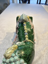 A pair of Chinese verte biscuit models of Buddhist lions, 18th C.