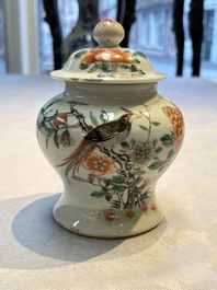 A pair of Chinese famille verte covered jars, a Tieguai Li figure, a blue and white teapot and a biscuit saucer, Kangxi and Qing Yu Tang mark, 19th C.