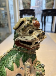 A pair of Chinese verte biscuit models of Buddhist lions, 18th C.