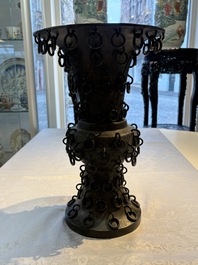 A Chinese archaistic bronze 'Zun' vase with 99 rings, 18/19th C.