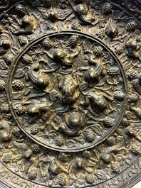 Two Chinese bronze mirrors, one inscribed &lsquo;Fu Shan Shou Hai 福山壽海' and the other with sea animals and grape design, Qing