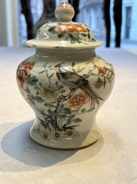 A pair of Chinese famille verte covered jars, a Tieguai Li figure, a blue and white teapot and a biscuit saucer, Kangxi and Qing Yu Tang mark, 19th C.