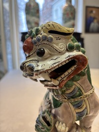 A pair of Chinese verte biscuit models of Buddhist lions, 18th C.