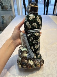 A pair of Chinese famille verte covered jars, a Tieguai Li figure, a blue and white teapot and a biscuit saucer, Kangxi and Qing Yu Tang mark, 19th C.