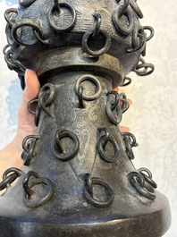 A Chinese archaistic bronze 'Zun' vase with 99 rings, 18/19th C.