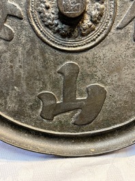 Two Chinese bronze mirrors, one inscribed &lsquo;Fu Shan Shou Hai 福山壽海' and the other with sea animals and grape design, Qing