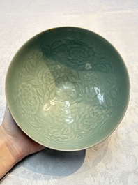 A fine Korean celadon moulded 'Peony Scroll' bowl with a wooden box, Goryeo, 13th C.