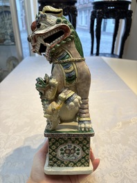 A pair of Chinese verte biscuit models of Buddhist lions, 18th C.