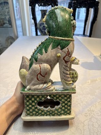 A pair of Chinese verte biscuit models of Buddhist lions, 18th C.