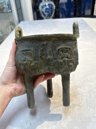 A Chinese archaic bronze food vessel with Taotie design, 'Ding 鼎', late Shang