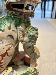 A pair of Chinese verte biscuit models of Buddhist lions, 18th C.