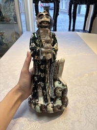 A pair of Chinese famille verte covered jars, a Tieguai Li figure, a blue and white teapot and a biscuit saucer, Kangxi and Qing Yu Tang mark, 19th C.