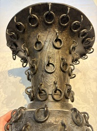 A Chinese archaistic bronze 'Zun' vase with 99 rings, 18/19th C.