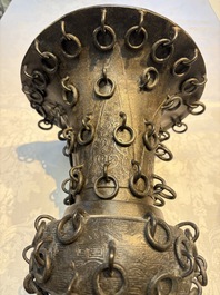 A Chinese archaistic bronze 'Zun' vase with 99 rings, 18/19th C.