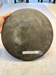 Two Chinese bronze mirrors, one inscribed &lsquo;Fu Shan Shou Hai 福山壽海' and the other with sea animals and grape design, Qing