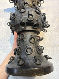 A Chinese archaistic bronze 'Zun' vase with 99 rings, 18/19th C.